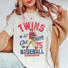 Step up to the plate in style with the "Vintage Baseball Team" Tee, showcasing iconic designs of your favorite MLB teams from the golden era of baseball. Crafted from premium fabric, this tee ensures both comfort and durability, making it perfect for honoring the rich history of America's favorite pastime. The vintage-inspired designs capture the nostalgia and heritage of classic MLB teams, bringing the spirit of the ballpark to your wardrobe. Whether you're cheering from the stands or reminiscing about baseball legends of yesteryear, this tee is the perfect choice for any fan. Its relaxed fit guarantees all-day comfort, while the authentic vintage designs add a touch of retro charm to your ensemble. From game days to casual outings, this tee is a versatile addition to your wardrobe, allow College Tops With Sublimation Print For Baseball Season, Collegiate Baseball Jersey With Graphic Print For Fans, Throwback Tops For Baseball Game Day, Throwback Letter Print T-shirt For College, Throwback Baseball Jersey With Letter Print, Throwback Short Sleeve Baseball Jersey With Letter Print, Tri-blend T-shirt With Graphic Print For Baseball Season, Throwback Baseball Fan Tops, Throwback Cotton Tops For Baseball Season