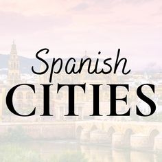 the words spanish cities in front of a river