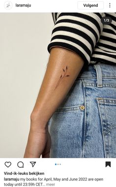 a woman with a small tattoo on her arm