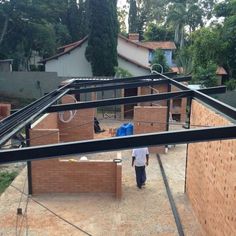 a man is walking through an unfinished house