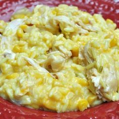 a red plate topped with macaroni and cheese