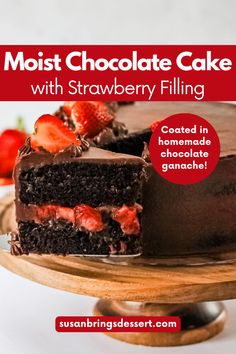 a chocolate cake with strawberries on top and the words, most chocolate cake with strawberry filling