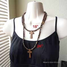 "I designed this earthy looking casual cross necklace for men and women, by combining natural materials: Robles wood cross in shade of light to dark brown, Bloodstone round beads in multi-colors of green, mustard, maroon, tan etc. with characteristic red spots which said to be blood of Christ in legend, and coconut palm wood beads in a brown hue. I have also added some antiqued brass spacers for a touch of vintage look, and finished off with a lobster clasp in antiqued brass. Lead-safe. The pict Adjustable Brown Cross Pendant Necklace, Brown Crucifix Necklace In Spiritual Style, Brown Spiritual Necklace With Cross Pendant, Spiritual Brown Crucifix Necklace, Spiritual Brown Cross Necklace, Bohemian Brown Cross Necklace, Brown Bohemian Cross Necklace, Brown Wooden Beads Cross Necklace, Brown Cross Necklace With Wooden Beads