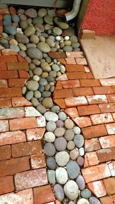 a brick path made out of rocks and stones in the shape of a person's body