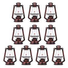 twelve antique style oil lamps with glass shades on each one and the top light is red