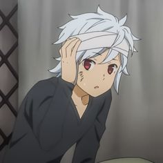 an anime character with white hair and red eyes sitting in front of a curtain holding his hand to his head