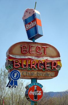 a sign for a restaurant that is advertising the best burger