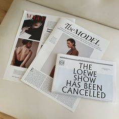 three magazines are laying on top of each other, with the covers pulled back and folded down