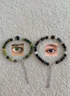 two bracelets with green beads and an eye on them are shown in front of a white carpet