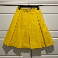 This Is A Sandee Royalty Yellow Pleated Skirt Midi Very Cute And Fun Skirt Zips In The Back Heavy Made With Thick Silky Lining Measurements Flat Waist 13” Length 22” No Stretch Spring Knee-length Flowy Skort, Flowy Knee-length Skort For Spring, Yellow A-line Pleated Skirt, Spring A-line Pleated Mini Skirt, Spring Knee-length Lined Skort, Pleated A-line Mini Skirt For Spring, Spring Knee-length Pleated Skort, Yellow Pleated Party Bottoms, Pleated A-line Skort For Spring