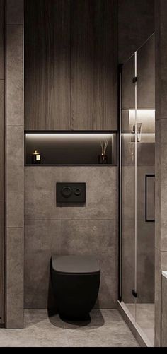 a bathroom with a toilet, sink and shower stall in the middle of the room