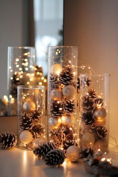 50 Stunning Christmas Centerpiece Ideas for Any Style Gold Table Centerpieces For Party, Fairy Light Centerpiece Ideas, Christmas Decorations With Water Beads, Modern Holiday Centerpieces For Tables, Pine Cone Centerpiece Christmas, Holiday Table Centerpieces Christmas, Christmas Glass Jars Decorations, Winter Party Table Decor, Christmas Party Table Decorations Diy