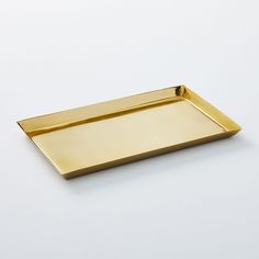 an empty gold tray on a white background