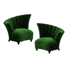 two green velvet chairs with black legs