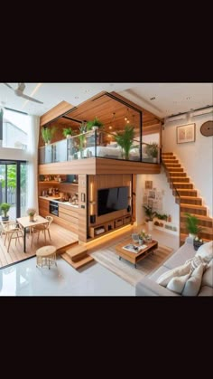 a living room filled with furniture and a flat screen tv sitting on top of a wooden table