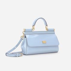 Introducing the Sicily Small Handbag, a brand icon that combines practicality and style in one compact design. Crafted from glossy calfskin, this bag features an adjustable, detachable crossbody strap for convenience. Embellished with a branded tag and two metal plating finishes, it's a must-have for any fashion-forward individual. Elegant Bags With Glossy Finish And Double Handle, Elegant Double Handle Bags With Glossy Finish, Elegant Glossy Finish Shoulder Bag For Travel, Luxury Shoulder Bag With Glossy Finish And Double Handle, Elegant Double Handle Shoulder Bag With Glossy Finish, Elegant Patent Leather Shoulder Bag For Everyday Use, Elegant Everyday Patent Leather Shoulder Bag, Designer Glossy Finish Crossbody Shoulder Bag, Elegant Patent Leather Bag With Glossy Finish