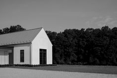 a black and white photo of a small building