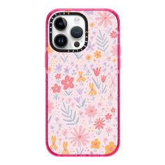 an iphone case with pink flowers and dots on the front, sitting on a white surface