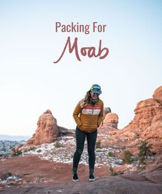 a woman standing on top of a rock in the desert with text reading packing for moab