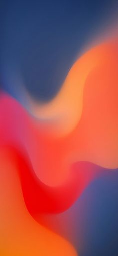 an abstract blurry background with red, orange and blue colors