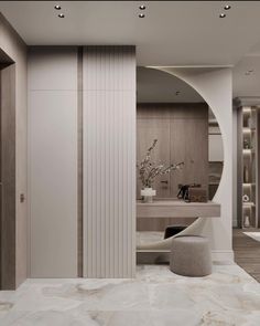 an elegant bathroom with marble floors and walls, along with a circular mirror on the wall