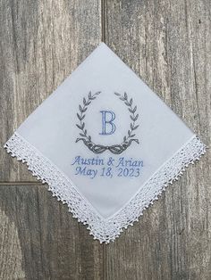 "Something blue, white wedding handkerchief, bridal gift, bride hanky, personalized white wedding hanky, gift for bride, bouquet.  These  white, lace handkerchiefs are embroidered with the couples names/date  and personalized with your choice of thread color or colors.  Please specify the colors you want for the wreath, the names/date. A truly elegant gift for a bridal shower, Mothers Day Gift, wedding, baptism or even for a housewarming.   All of these handkerchiefs are white and measure 12\"W Elegant White Handkerchiefs For Wedding Gift, White Monogrammed Handkerchiefs For Gift, White Monogrammed Handkerchiefs As Gift, White Monogram Handkerchiefs As Gift, Classic White Wedding Handkerchiefs, Elegant Personalized Handkerchief For Bridesmaid Gift, Elegant Monogrammed Handkerchiefs For Weddings, Elegant Monogram Handkerchiefs For Wedding, Elegant Personalized Handkerchiefs For Bridal Shower