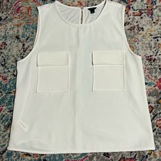 Excellent / Unworn Condition Ann Taylor Pearl Color Sleeveless Top Featuring Two Pockets In The Front | A Very Sophisticated Style | Perfect For Any Occasion From Work To A Social Gathering Taylor White, Social Gathering, Pearl Color, Sophisticated Style, Ann Taylor, Sleeveless Top, Color White, Womens Tops, Women Shopping