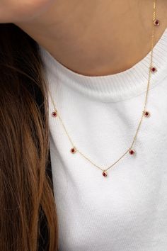 Welcome to PoshGoldJewelry, A new collection of necklaces are now available in our shop. Our gemstone chokers are dainty yet perfect for every woman. Necklace Information: - Material: 14K Solid Gold - Gemstone: CZ Simulated Ruby (Total of 7 stones) - Chain Thickness: 0.70mm - Size of each setting: 4mm A hallmark (stamp) of the material of your necklace will be included for certification. - Gift Box with each order! ✔️ You can contact us for the creation of your custom pendant. ✔️ Contact us for Red Round Jewelry, Dainty Red Round Jewelry, Red Gemstone Round Necklace, Gemstone Choker Necklace For Gift, Red Round Gemstone Necklace, Dainty Choker Necklaces For Valentine's Day, Red Ruby Round Necklaces, Red Ruby Choker Jewelry, Dainty Choker Jewelry For Valentine's Day