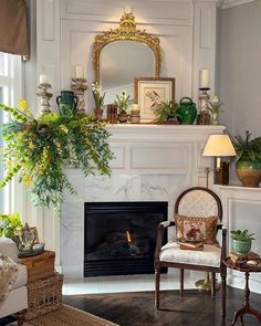 a living room filled with furniture and a fire place in front of a mirror on the wall