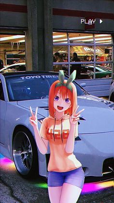 a woman is standing in front of a car and giving the peace sign with her hand