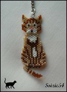 a cat made out of beads on a chain