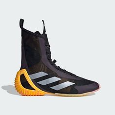 the adidas basketball shoe is shown in black and yellow