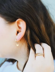 Adorn you hands with this timeless Minimal Initial Signet Ring. Hand-crafted from 14K yellow gold filled, this ultra-chic ring is a perfect gift for moms or couples. It's a unique, minimal piece with the power to carry a special, sentimental message. Rings are handmade in our Indiana studio. There will be a small color difference in the gold where it is soldered together in our studio. Please add initial in the NOTES box at checkout. Tiny 14k Gold Filled Everyday Jewelry, Dainty Tiny Jewelry For Everyday Wear, Dainty Tiny Jewelry For Everyday, Simple Design Gold Stackable Rings As Gift, 14k Gold Filled Stackable Rings As Gift, Fine Jewelry In 14k Gold Filled With Tiny Details, Hypoallergenic 14k Gold Round Band Jewelry, Delicate Hypoallergenic 14k Gold Midi Rings, 14k Gold Filled Rose Gold Round Band Jewelry