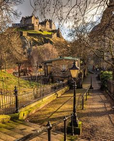 the stairs lead up to an old castle