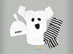 Such a sweet and spooky little outfit! Perfect for your newborn at halloween.  Listing includes your choice of: - White bodysuit, short or long sleeve, with ghost face added - Handmade Black & White Stripe Leggings - Handmade White knot hat with babys name or "peek a boo"  Sizing  See size charts in listing.  Matching Tees  Visit our shop to find matching tshirt for toddlers and mamas!  Timing  Generally ships the next business day.  During peak holiday season, if a particular size runs out it m Cute White Halloween Onesie, Cute White Bodysuit For Halloween, Baby Ghost Costume, Newborn Halloween Outfits, Bodysuit Short, Newborn Halloween, Outfit Baby Boy, Ghost Costume, Baby Boy Clothing Sets