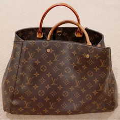 Size Base Length: 11.5 In Height: 7.75 Inwidth: 5 In Drop: 3.75 Indrop: 23 In Dust Bag, Strap, Clochette, Lock & 2 Keys. Bought From France At Vacation. This Is An Authentic Louis Vuitton Monogram Montaigne Bb. This Chic Tote Is Crafted Of Louis Vuitton Monogram Coated Toile Canvas. The Handbag Features Rolled Vachetta Leather Top Handles, A Removable Monogram Coated Canvas Shoulder Strap, And Polished Gold-Toned Hardware. The Top Is Open To A Partitioned Plum Purple Microfiber Interior With Patch Pockets And A Central Monogram Zipper Compartment. (Damage: Little Cracks On Detached Long Handles, Due To Not Using For A Long Time) Plum Purple, Long Handles, Leather Top, Authentic Louis Vuitton, Womens Tote Bags, Louis Vuitton Bag, Louis Vuitton Monogram, Patch Pocket, Dust Bag