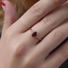 You deserve to own this beautiful Celtic Ruby gemstone ring. Made by hand to your size and choice of finish. ✦ Gemstone Type - Lab grown Ruby, White Zircon ✦ Gemstone Cut - Oval facet ✦ Gemstone Size - 7x5 (oval) 1.5mm (round) ✦ Total Number of Gemstones - 3 ✦ Finish - 14k Gold Filled (Tarnish Resistant And Nickel Free) - also available in 925 sterling silver * For rings over size 11 please contact us for special pricing. * Custom made designs questions are welcome! ♢ Important information ✦ We Gold Rings With Ruby Stone, Gold Rings With Red Stone, Ruby Wedding Rings Vintage, Red Ruby Rings, Red Rings Engagement, Stone Ring Design Gold For Women, Hand Rings Gold, Ruby Rings Women, Rubi Ring