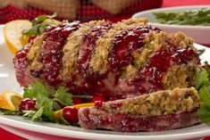 a meatloaf with cranberry sauce on it