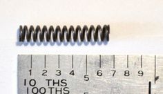 a metal ruler with the words, 10 ths and 100ths on it