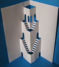 an open card with stairs going up to the top and bottom, on a blue background