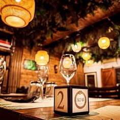 the table is set for two people to enjoy their meal at, and there are wine glasses in front of it