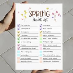 someone holding up a spring bucket list