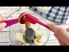 someone is using a food processor to make banana slices