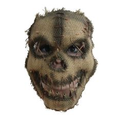 a creepy looking mask made out of burlocked material with spikes on it's head