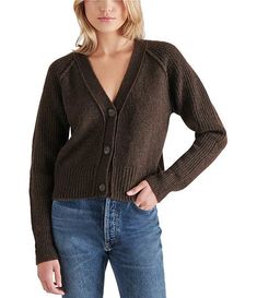 Stay snuggled up all season long in the Steve Madden BECKIE Chestnut Brown CARDIGAN. Made with a touch of luxurious wool, this cozy V-neck cardigan features soft ribbing for added comfort. Perfect for layering with any outfit while staying stylishly warm. 20" Length Machine Wash Tumble Dry 81% Polyester 7% Acrylic 7% Nylon 5% Wool Sweater Season, Brown Cardigan, Cute Cardigans, Loungewear Jumpsuit, Chestnut Brown, V Neck Cardigan, Cute Sweaters, Textured Knit, Cozy Knits