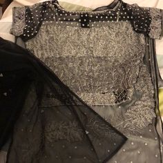 This Is A Three-Piece Outfit. 28 Inch Around Waist For The Skirt And The Hips Or 19 Inches Wide Across The Skirt Length Is 42inches. Comes With A Black Netting Type Scarf. This Outfit Has Never Been Worn It Is Brand New Elegant Silver Lehenga, Glamorous Black Sets For Festive Occasions, Silver Fitted Lehenga For Party, Silver Embellished Lehenga For Party, Silver Elegant Lehenga For Party, Silver Lehenga For Festive Party, Fitted Silver Sets For Evening, Festive Silver Lehenga For Party, Silver Evening Sets For Festive Occasions