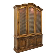 an antique china cabinet with glass doors and carvings on the front, against a white background