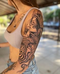 a woman with a tattoo on her arm