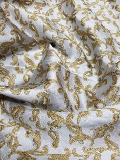 "Handcrafted beautiful brocade with mettallic thread soft fabric usable for apparel,accessories and interior designs. Reversible can be used both sides Beautifully made to use for costumes, dance wear, decorations, weddings and much more. Width : 45\" inches Color : beige gold Thank you for your coming! Please read policy before placing an order. Please contact us via ETSY Conversations for more details. Fabrics are sold by the yard. We will continue length of multiple yards . It will come in on Elegant Gold Embroidered Raw Silk Fabric, Elegant Silk Fabric With Zari Work, Elegant Brocade Fabric With Gold Embroidery, Elegant Festive Jacquard Embroidered Fabric, Festive Elegant Jacquard Embroidered Fabric, Festive Cream Elegant Fabric, Embroidered Brocade Fabric In Gold, Embroidered Brocade Fabric For Party, Gold Embroidered Silk Fabric For Festivals