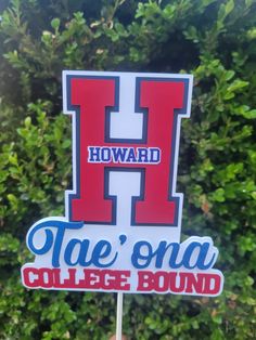 a hand holding up a sign that says howard tae'ona college bound